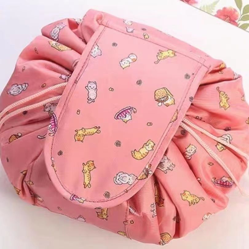 Folding induction lazy makeup bag drawstring waterproof cartoon cute storage bag autumn and winter cosmetic bag wholesale